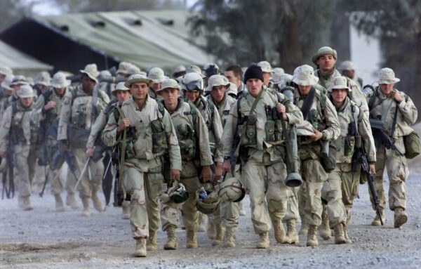 American Marines with full battle gear prepare to leave the U.S. military compound