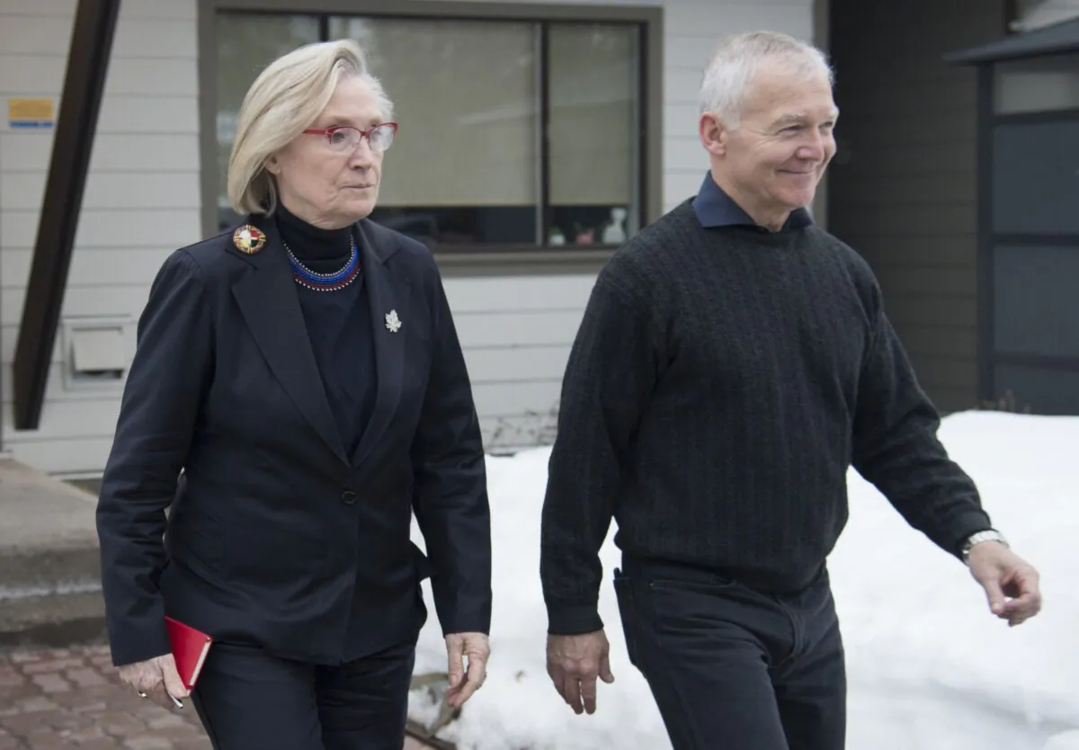 Federal Minister of Crown-Indigenous Relations Carolyn Bennett and B.C. Indigenous Relations Minister Scott Fraser arrive to address the media in Smithers, B.C., on Feb. 28, 2020. (The Canadian Press/Jonathan Hayward)