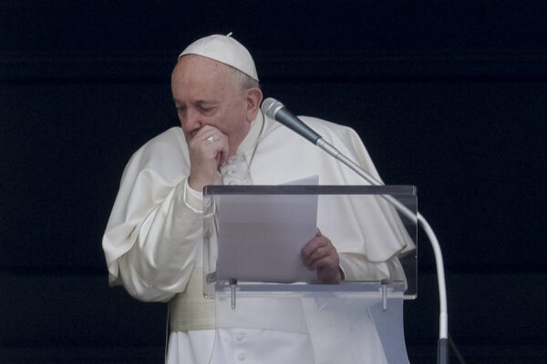 Pope Francis coughs during the Angelus noon prayer
