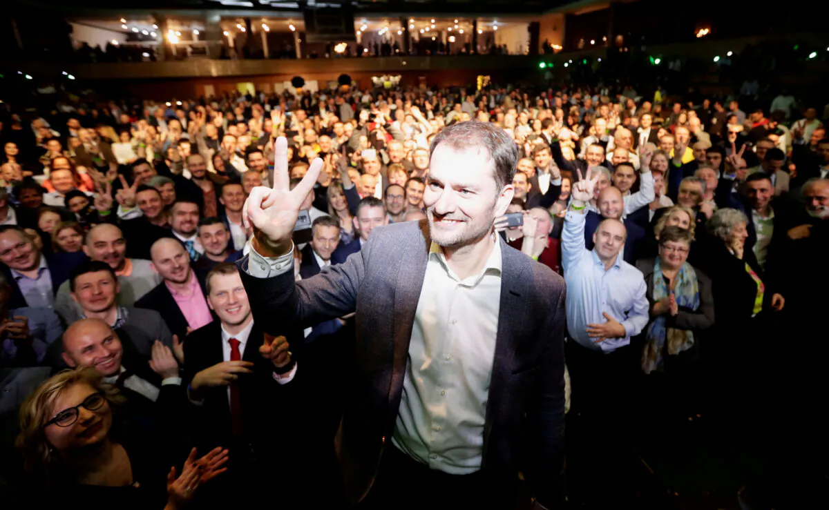 Ordinary People and Independent Personalities (OLaNO) party leader Igor Matovic gestures in front of  supporters at his party's headquarters after the country's parliamentary elections, in Trnava, Slovakia, early March 1, 2020. (REUTERS/David W Cerny)