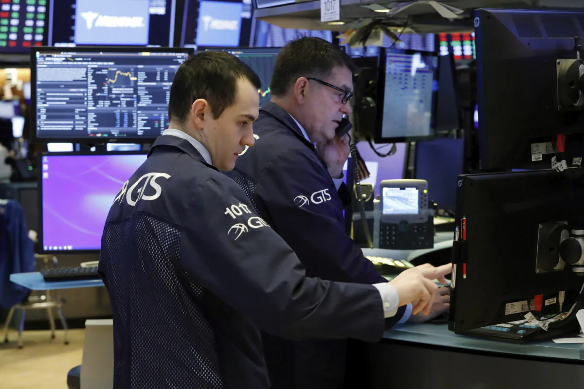 Specialists prepare for the day's trading activity on the floor of the New York Stock Exchange, on Monday, March 2, 2020. (Richard Drew/AP Photo)