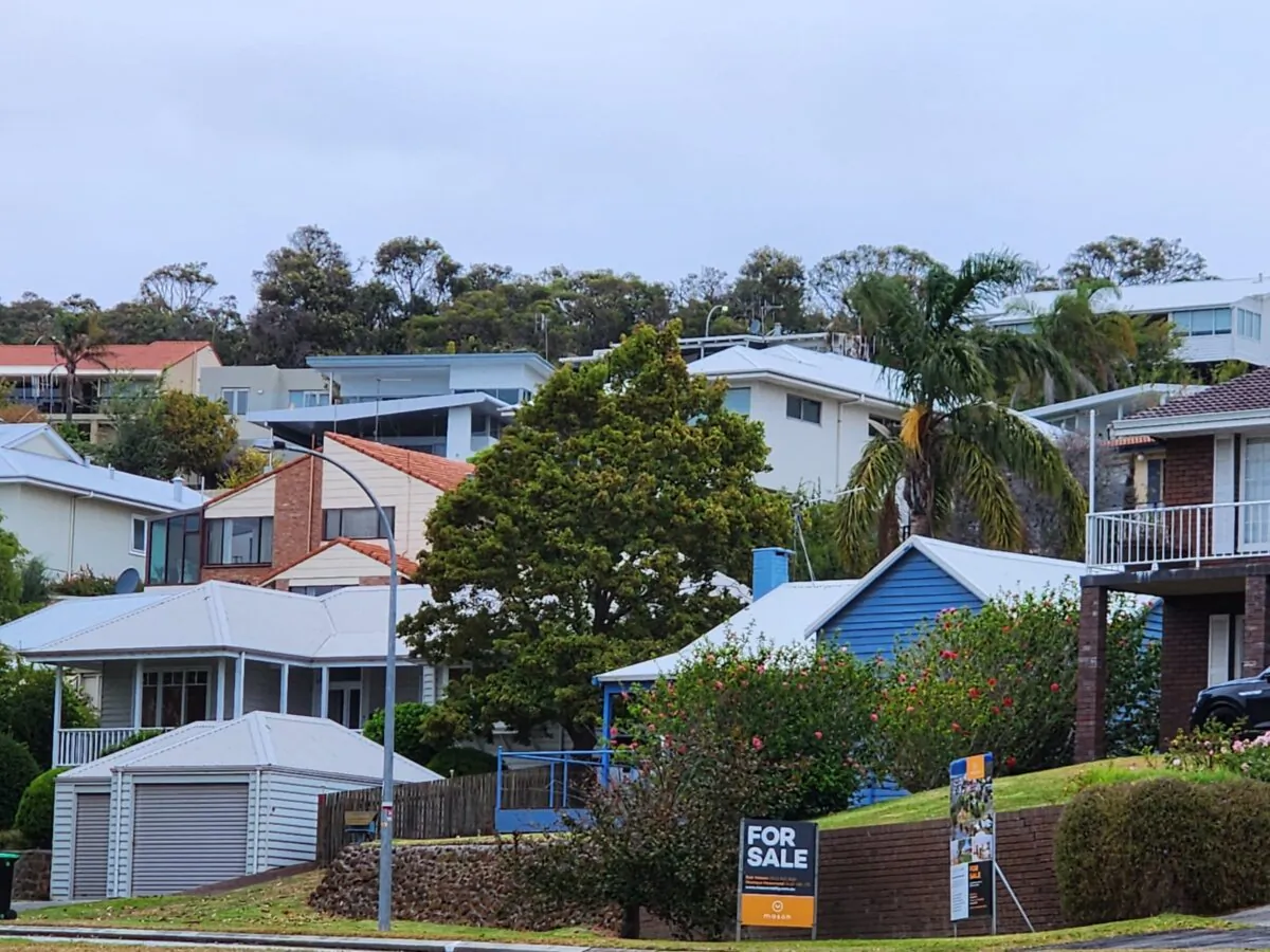 A for sale sign is seen in front of houses with a view in a wealthy, beachside suburb in Albany, Western Australia, on March 2, 2024. (Susan Mortimer/The Epoch Times)