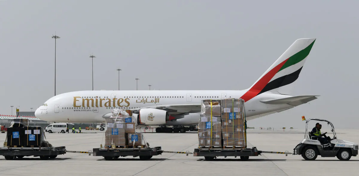 Tonnes of medical equipment and coronavirus testing kits provided by the World Health Organisation are pictured passing by an Emirates airlines Airbus A380-861, at the al-Maktum International airport in Dubai on March 2, 2020. (Karim Sahib/AFP via Getty Images)