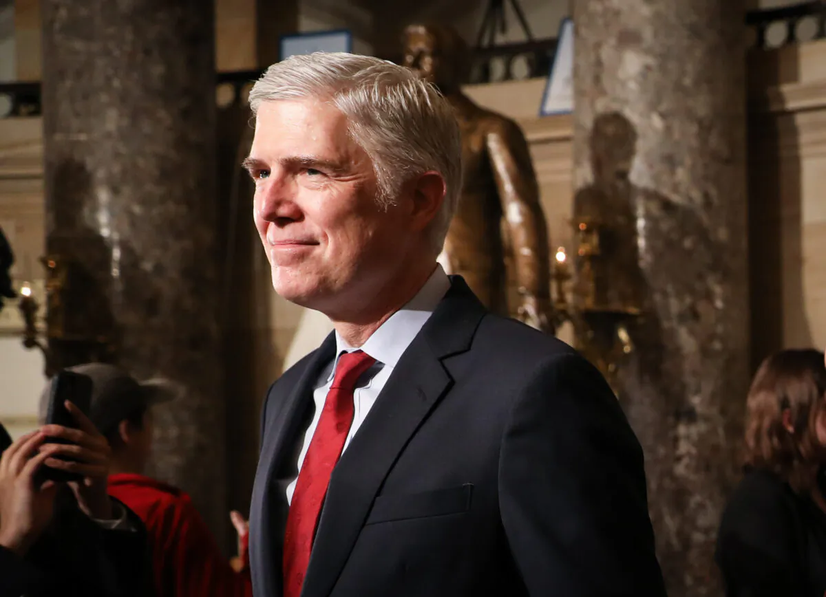 Supreme Court Justice Neil Gorsuch 
 walks through Statuary Hall to the House Chamber for President Donald Trump’s State of the Union address in the Capitol in Washington on Feb. 4, 2020. (Charlotte Cuthbertson/The Epoch Times)
