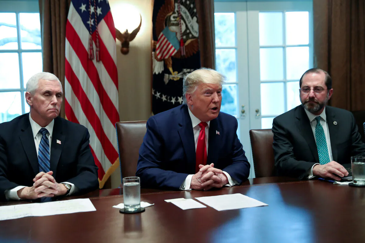 President Donald Trump, joined by Vice President Mike Pence (L) and Health and Human Services Secretary Alex Azar, speaks during a meeting with pharmaceutical executives to discuss developing a coronavirus vaccine, in the Cabinet Room of the White House on March 2, 2020. (Reuters/Leah Millis)
