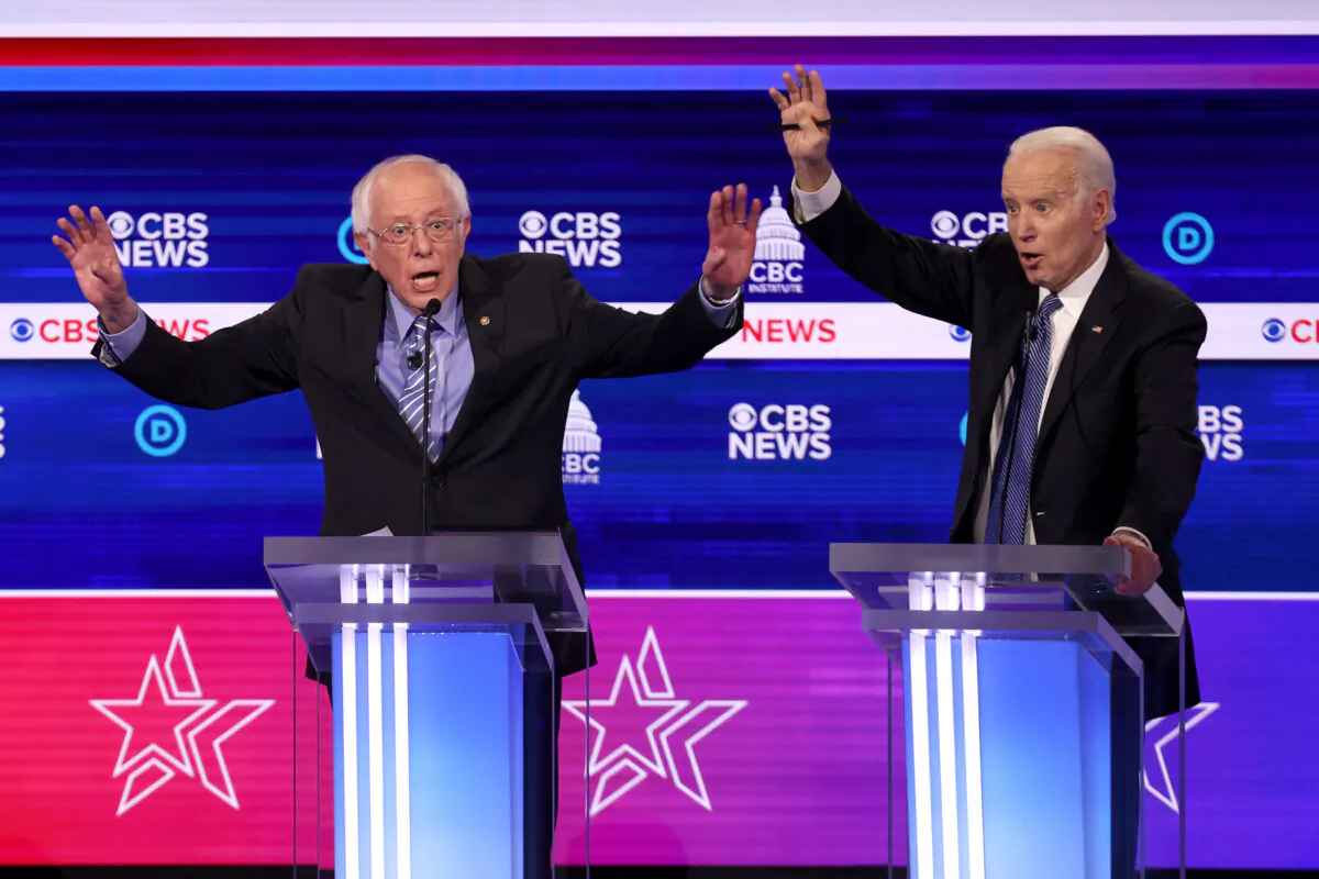Democratic presidential candidate Sen. Bernie Sanders (I-VT) (L) speaks as former Vice President Joe Biden reacts during the Democratic presidential primary debate at the Charleston Gaillard Center, S.C., on Feb. 25, 2020. (Win McNamee/Getty Images)