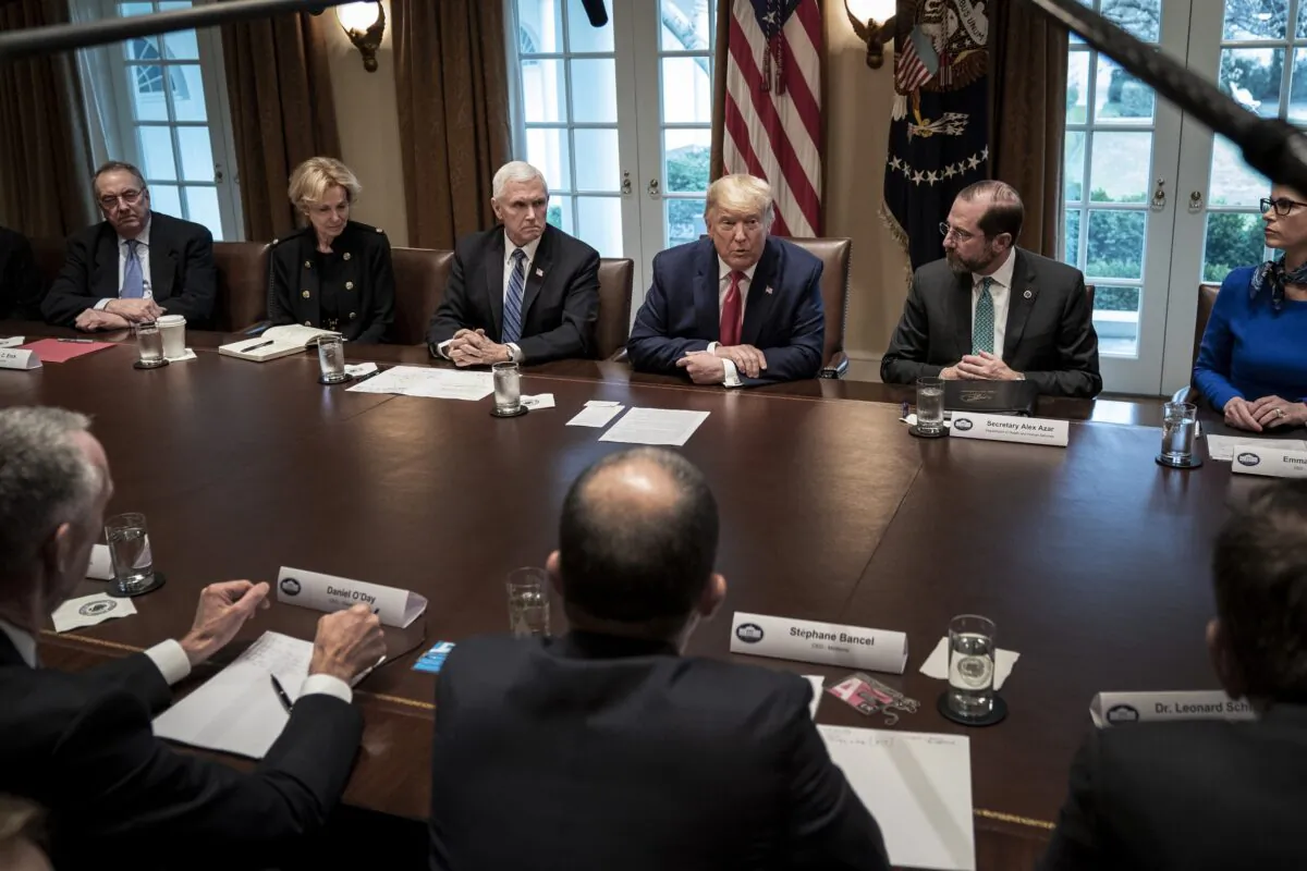 Flanked by Vice President Mike Pence (L) and Secretary of Health and Human Services Alex Azar, President Donald Trump leads a meeting with the White House Coronavirus Task Force and pharmaceutical executives in Cabinet Room of the White House in Washington on March 2, 2020. (Drew Angerer/Getty Images)