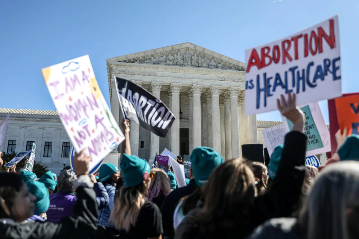 Pro-abortionists rally outside the Supreme Court in Washington on March 4, 2020. (Charlotte Cuthbertson/The Epoch Times)