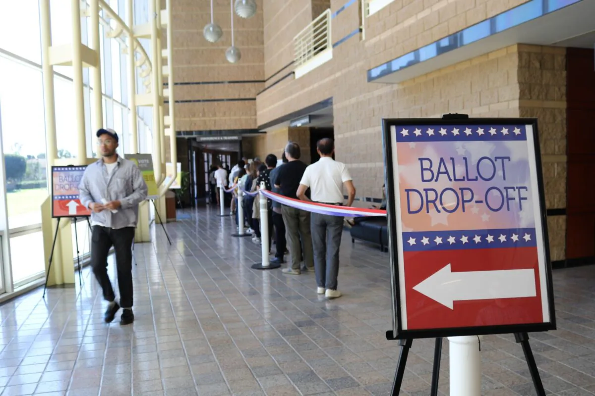Voters line up at the Irvine Valley College voting center in Irvine, Orange County, on March 3, 2020. (Jamie Joseph/The Epoch Times)