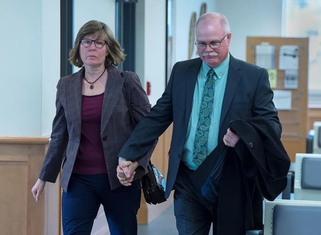 John Collyer, former Bridgewater police chief, heads into Nova Scotia Supreme Court for his sentencing with his wife Sheri Collyer in Bridgewater, N.S., on March 4, 2020. (Andrew Vaughan/The Canadian press)