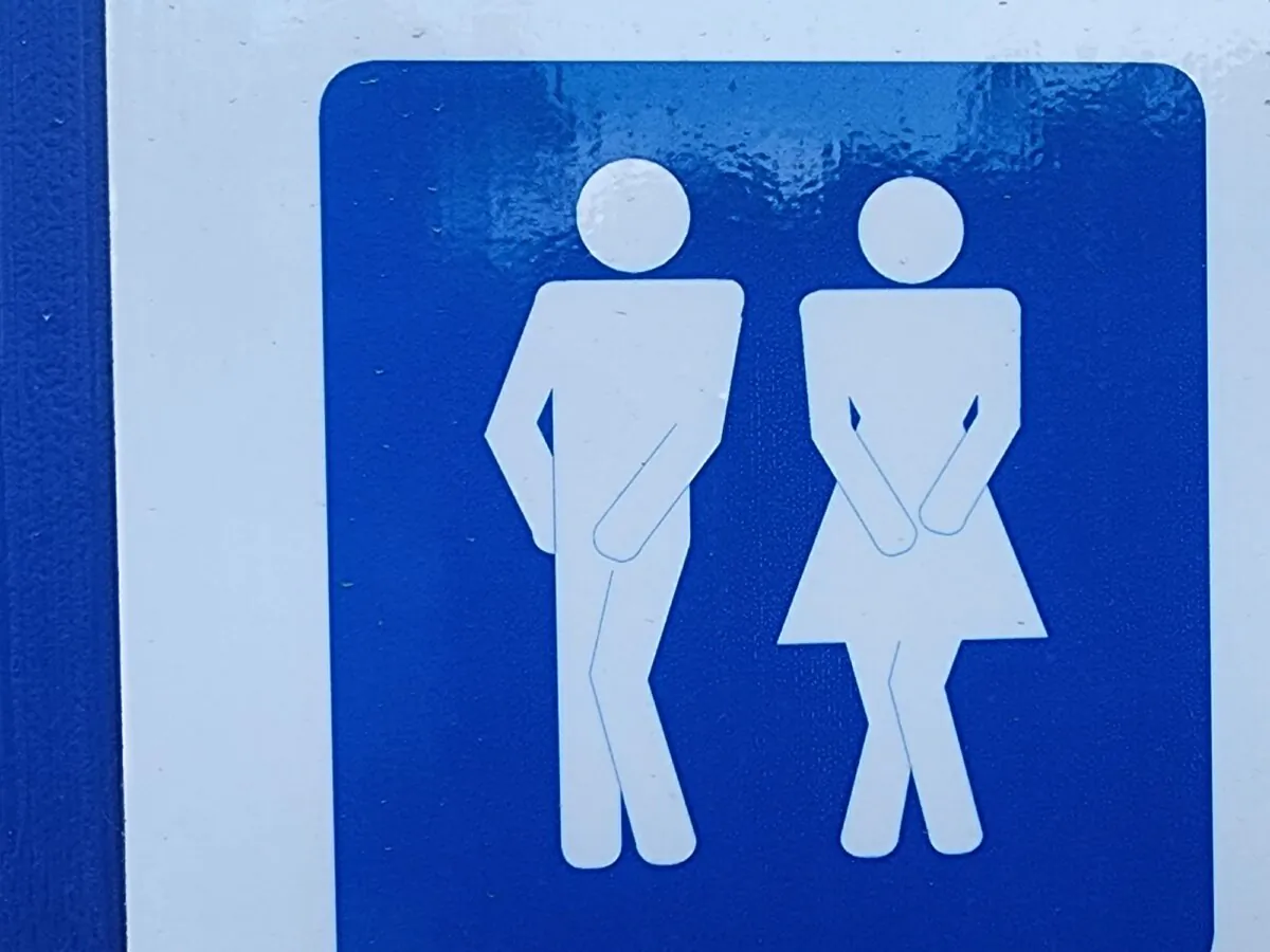 A sign designating male or female is seen in Albany, Western Australia, on April 4, 2024. (Susan Mortimer/The Epoch Times)