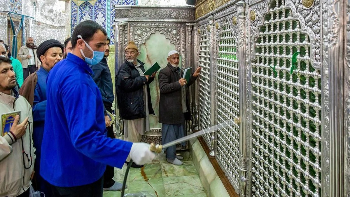 A man disinfects the shrine of Saint Masoumeh against coronavirus in the city of Qom 78 miles south of the capital Tehran, Iran, on Feb. 24, 2020. (Ahmad Zohrabi/ISNA via AP)
