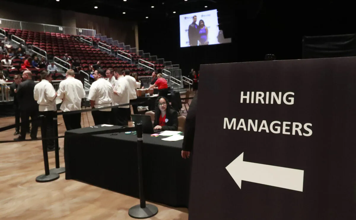 Managers wait for job applicants at a job fair in Hollywood, Fla., on June 4, 2019. (Wilfredo Lee/AP Photo)