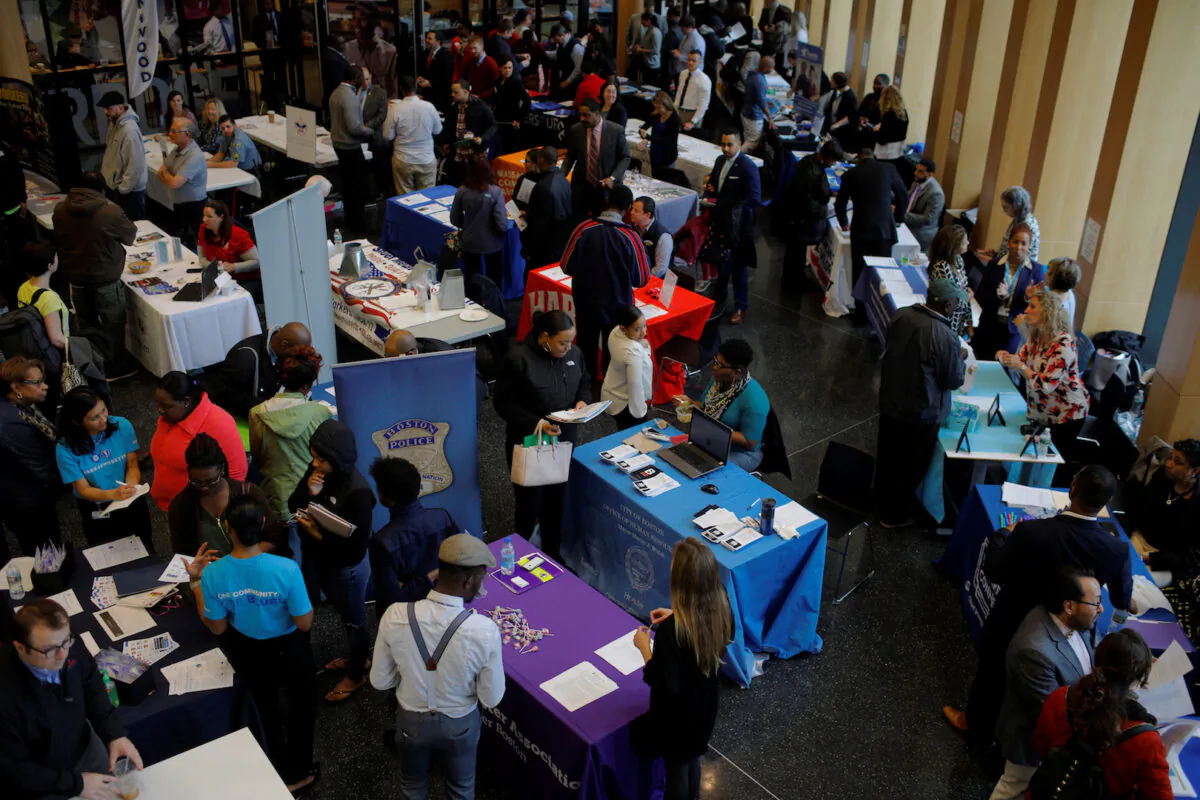 Job seekers speak with potential employers at a City of Boston Neighborhood Career Fair  in Boston, Mass., on May 1, 2017. (Brian Snyder/Reuters)