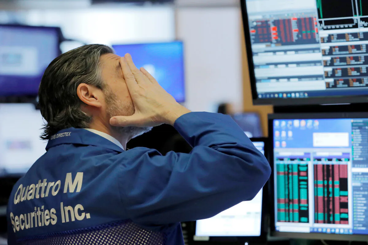 A trader works on the trading floor at the New York Stock Exchange in New York City on March 5, 2020. (Andrew Kelly/Reuters)