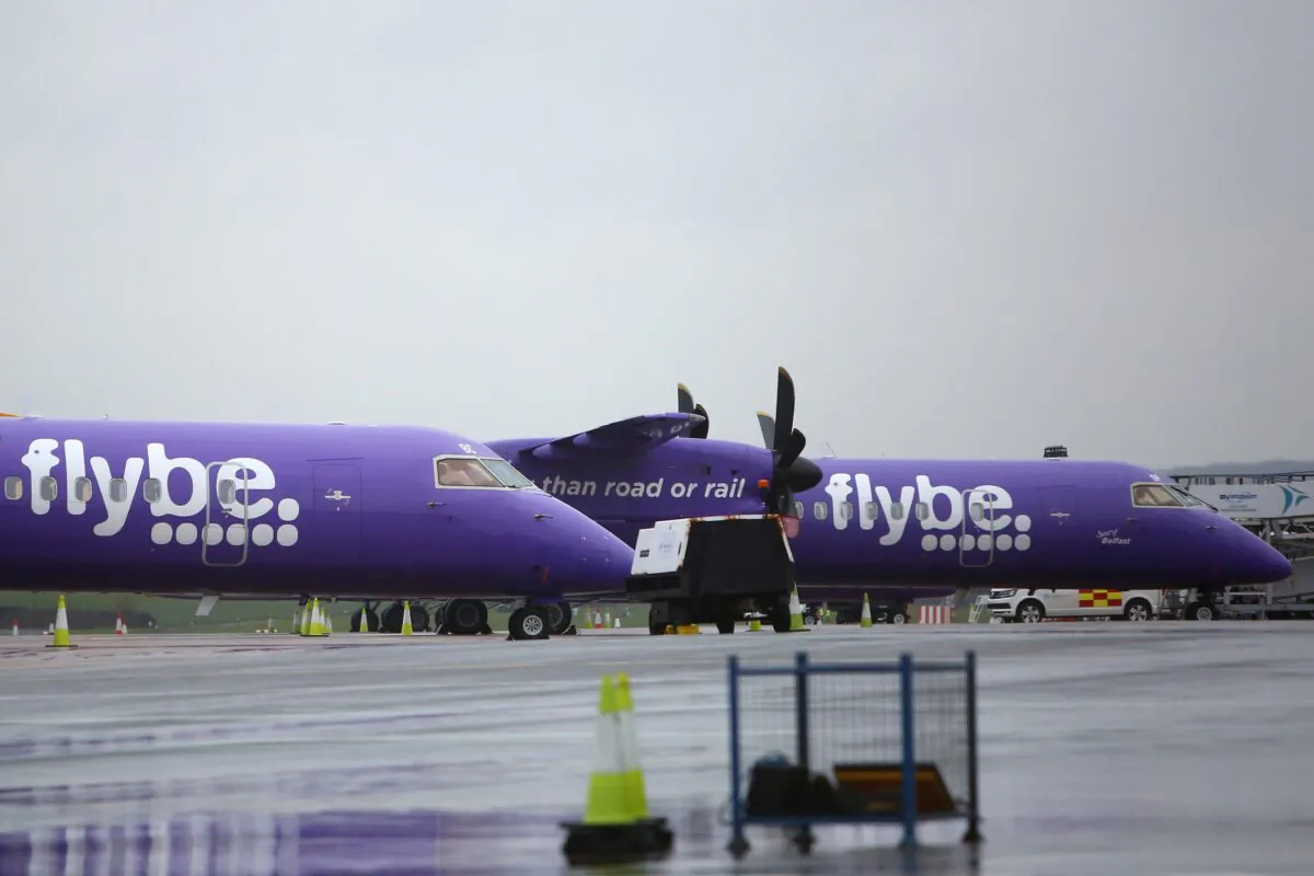 Flybe aircraft are pictured on the tarmac at Exeter airport in Exeter, south-west England, on March 5, 2020. (Geoff Caddick/AFP via Getty Images)