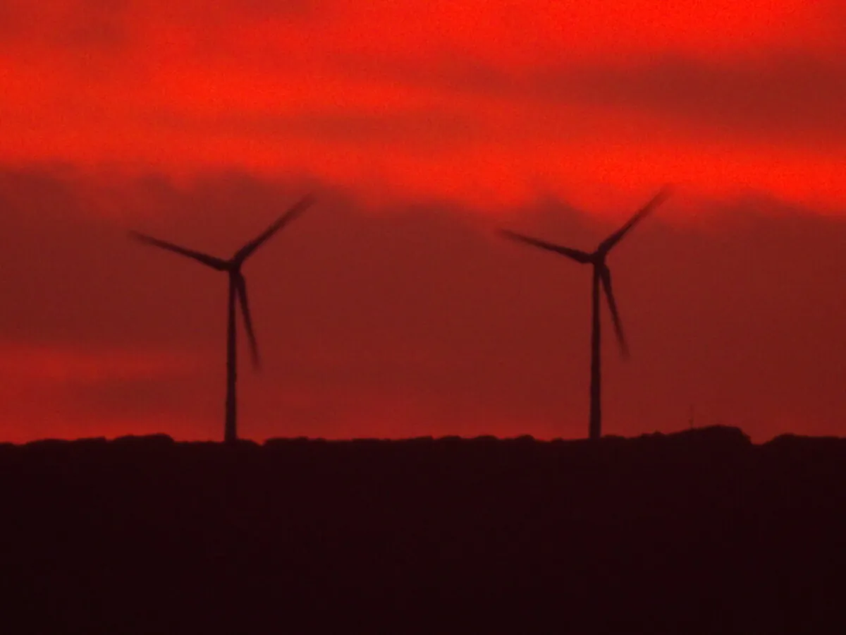 Two wind turbines are seen in Albany, Western Australia, on April 5, 2024. (Susan Mortimer/The Epoch Times)