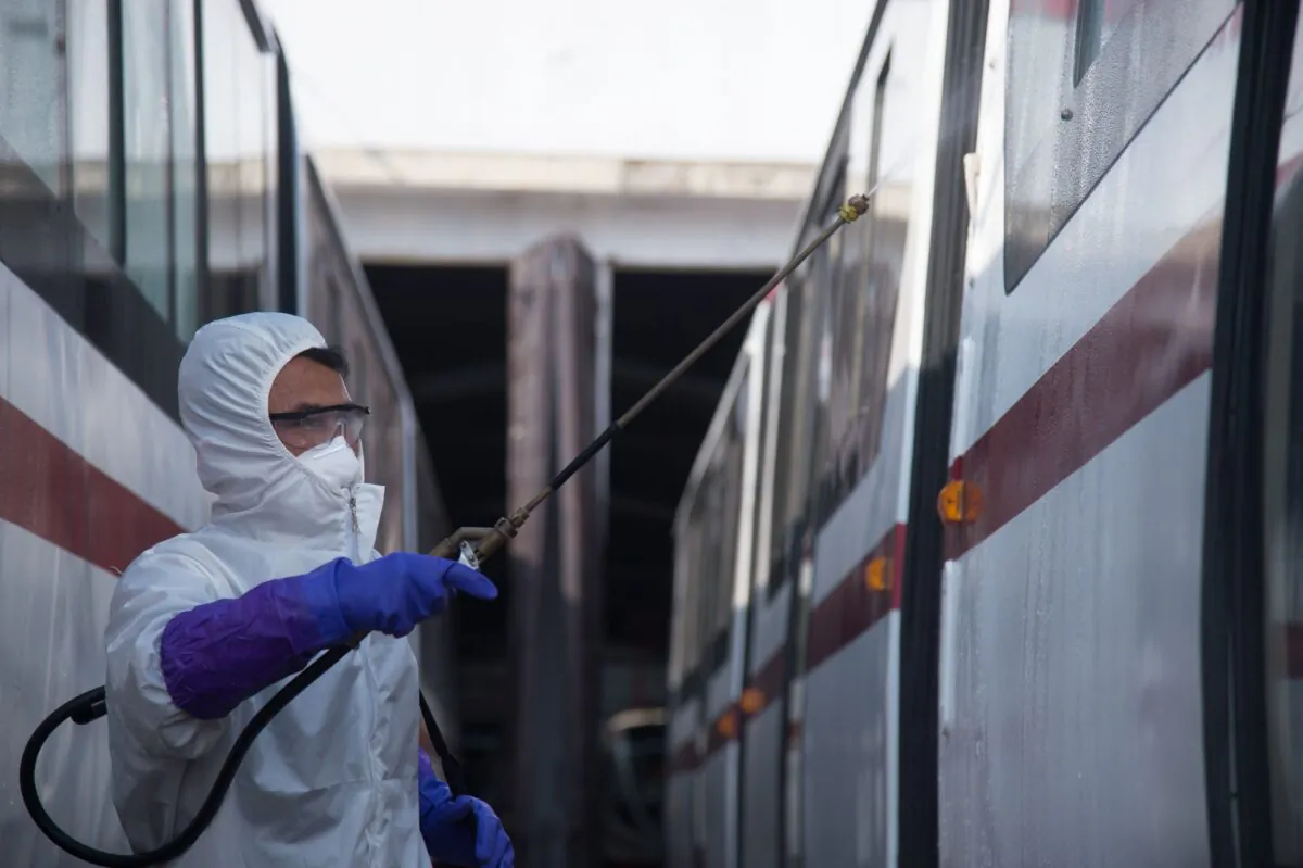An official from the Mangyongdae District emergency anti-epidemic headquarters disinfects a tramcar to prevent the spread of the COVID-19 coronavirus, at the Songsan Tram Station in Pyongyang on Feb. 26, 2020. (Kim Won Jin/AFP via Getty Images)