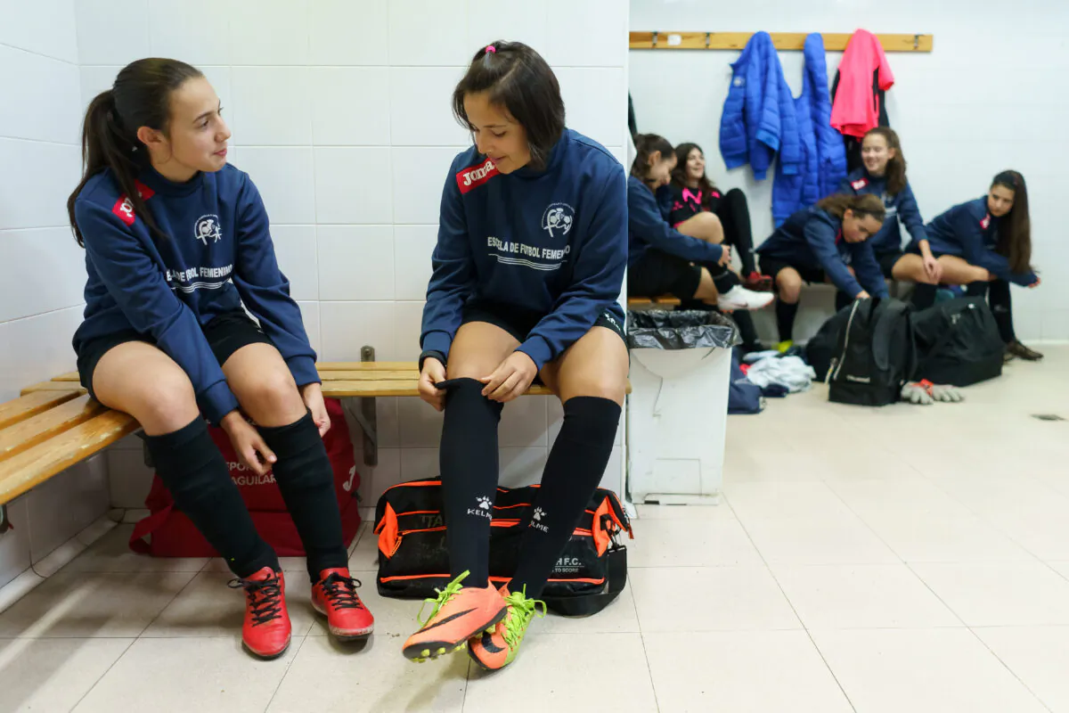 Young girls chat in a locker room before a training session in Valladolid, northern Spain, on Jan. 27, 2019. (Cesar Manso/AFP/Getty Images)