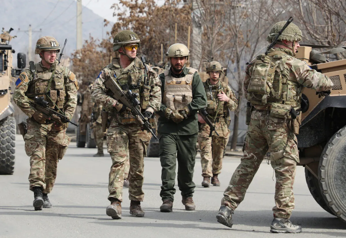British soldiers with NATO-led Resolute Support Mission arrive at the site of an attack in Kabul, Afghanistan, on March 6, 2020. (Omar Sobhani/Reuters)