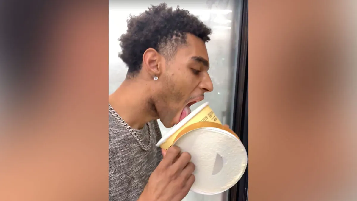 D'Adrien L'Quinn Anderson of Port Arthur, Texas, licks a tub of vanilla Blue Bell ice cream. (Facebook via CNN)