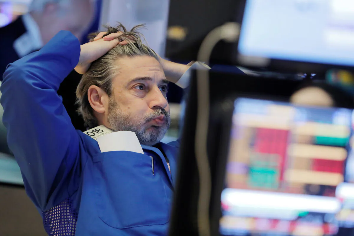 A trader works on the floor at the New York Stock Exchange in New York City on March 5, 2020. (Reuters/Andrew Kelly)