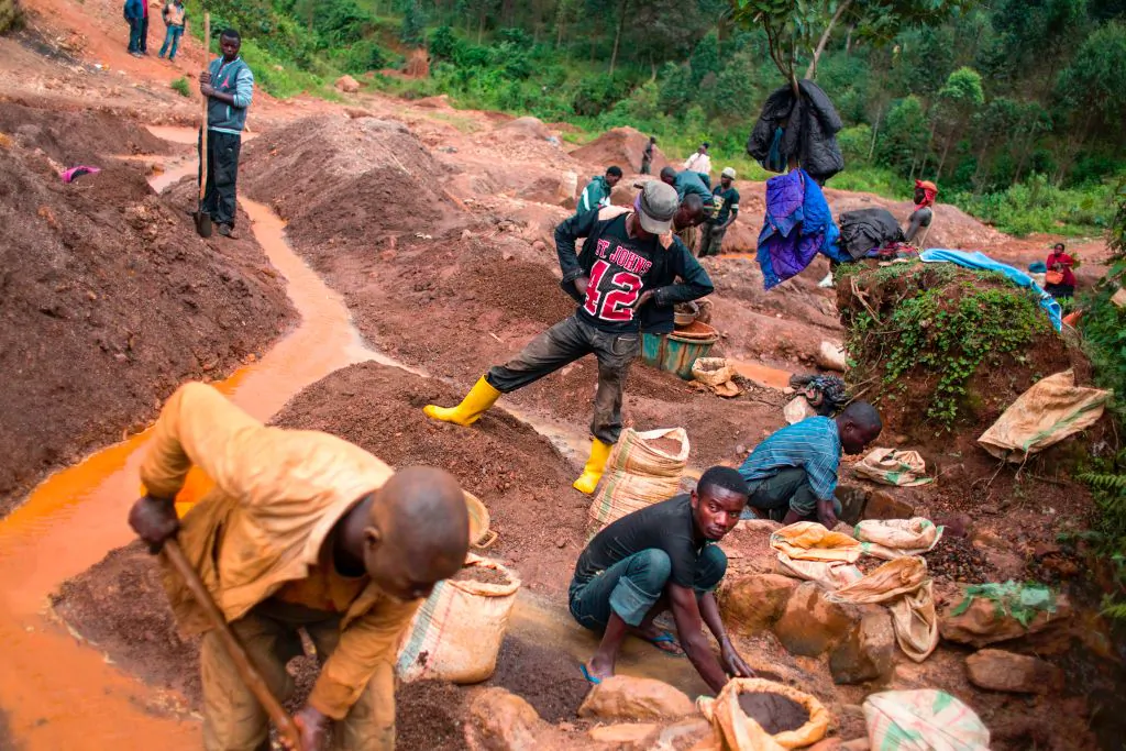 People work at the Kalimbi cassiterite artisanal mining site north of Bukavu, in the Democratic Republic of Congo, on March 30, 2017. (Griff Tapper/AFP via Getty Images)
