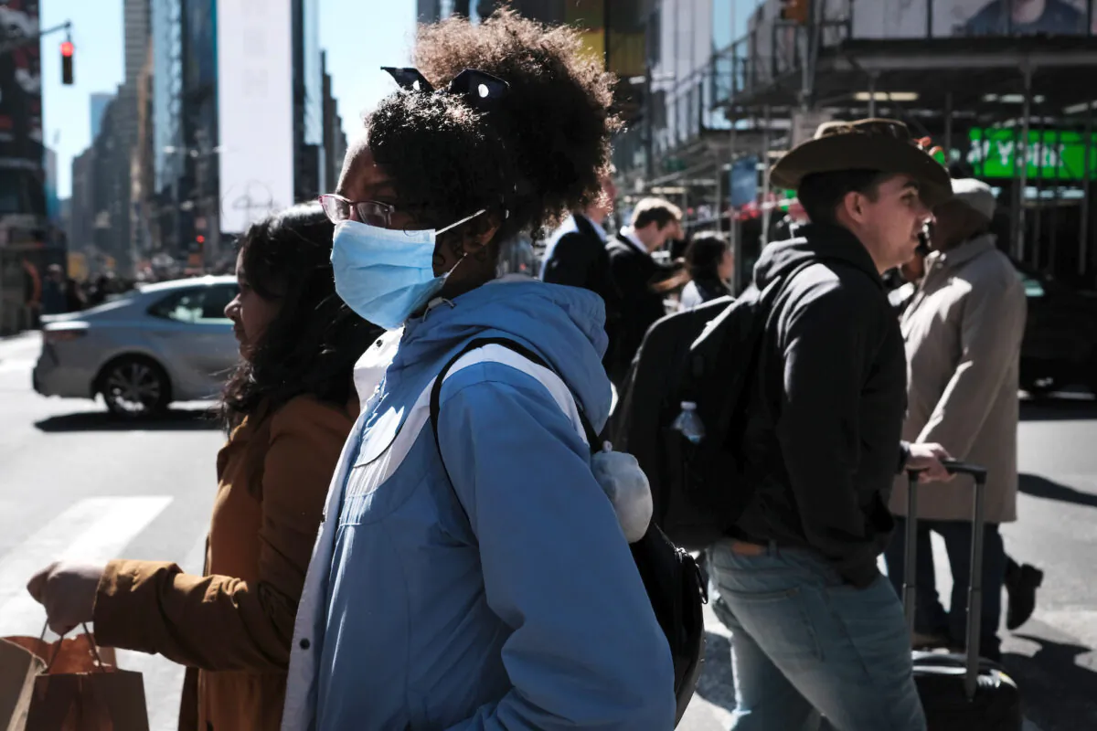 People walk through Manhattan with surgical masks in New York City on March 4, 2020. (Spencer Platt/Getty Images)