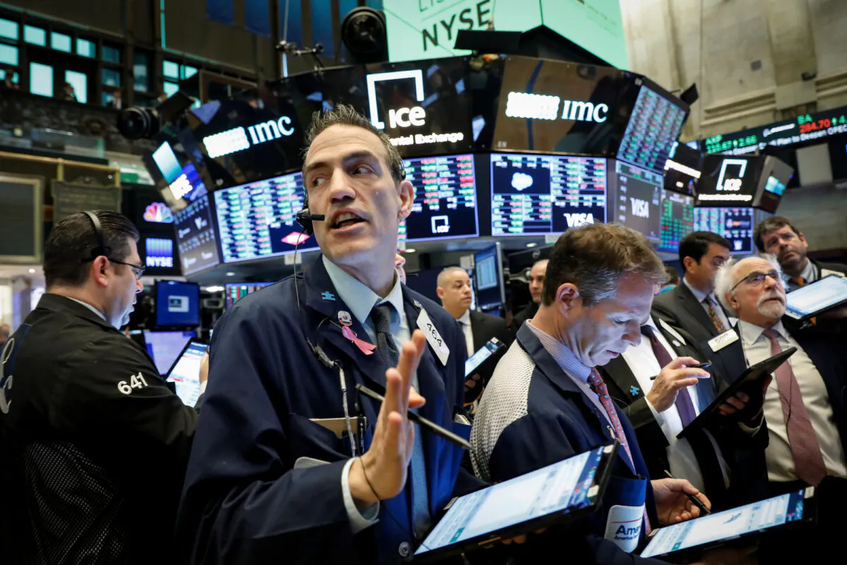 Traders work on the floor at the New York Stock Exchange (NYSE) in New York, on March 4, 2020. (Reuters/Brendan McDermid)
