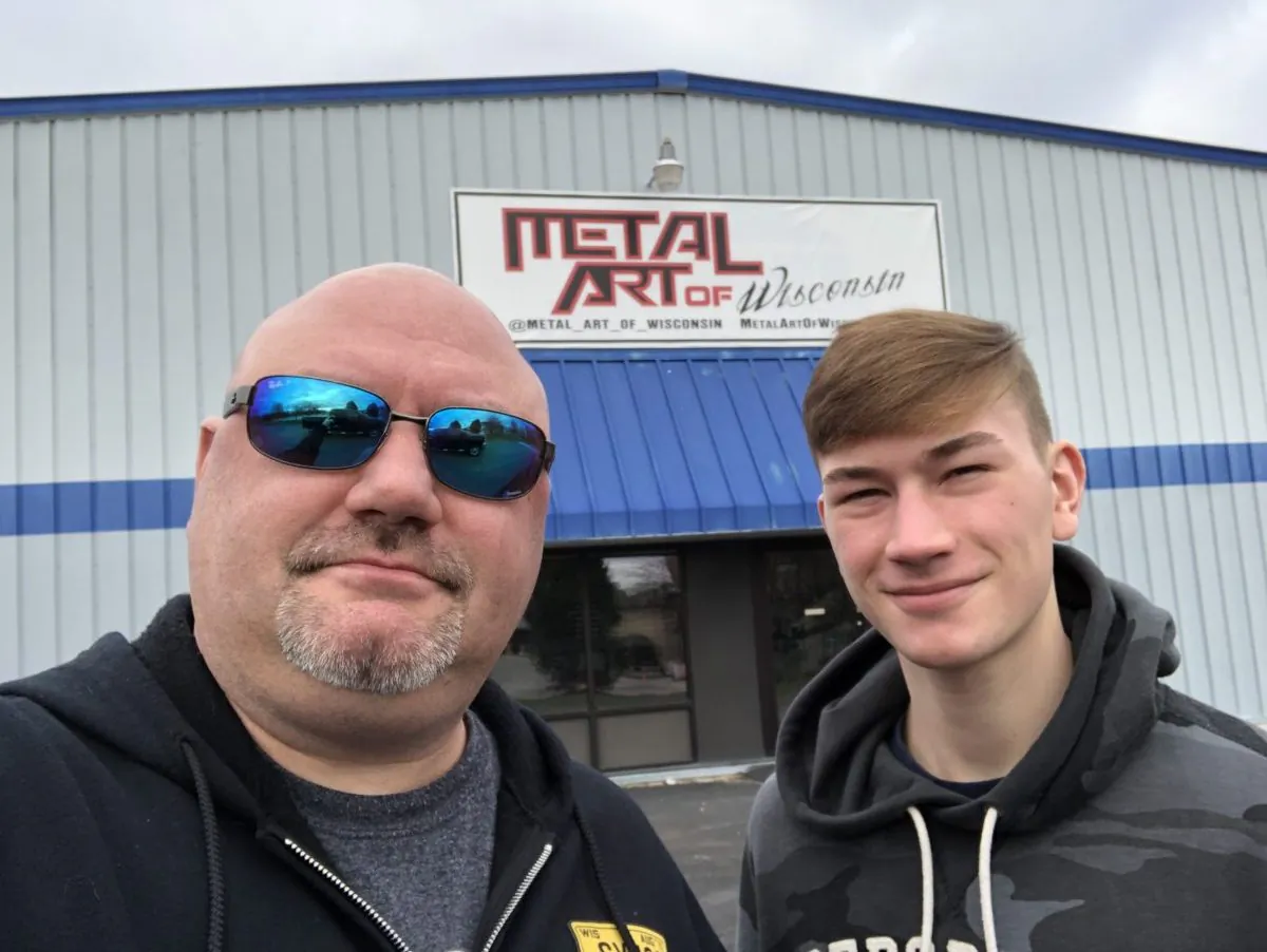 Shane Henderson with his son Justis outside of Metal Art of Wisconsin. (Courtesy of Shane Henderson)