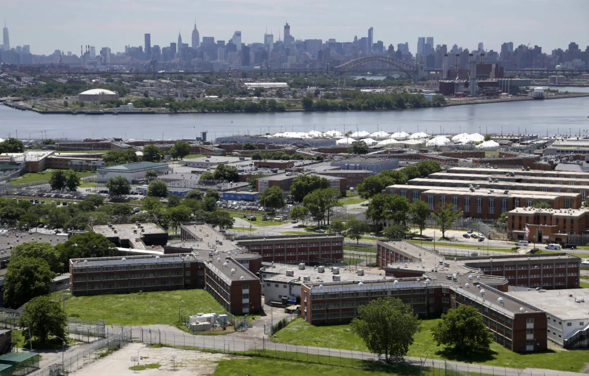 The Rikers Island jail complex stands in New York with the Manhattan skyline in the background, on June 20, 2014. (Seth Wenig/AP Photo)