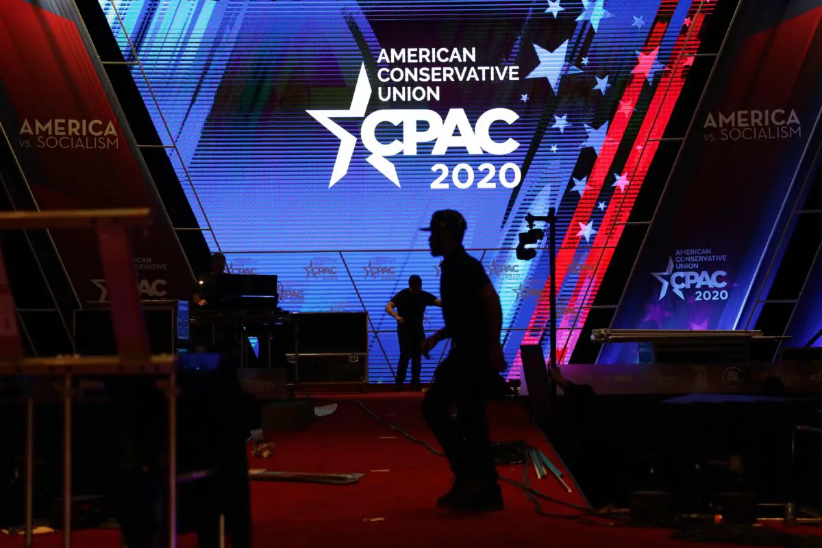 Members of set up crew work on the final setup during the annual Conservative Political Action Conference at the Gaylord National Resort Convention Center in National Harbor, Maryland, on Feb. 26, 2020. (Alex Wong/Getty Images)