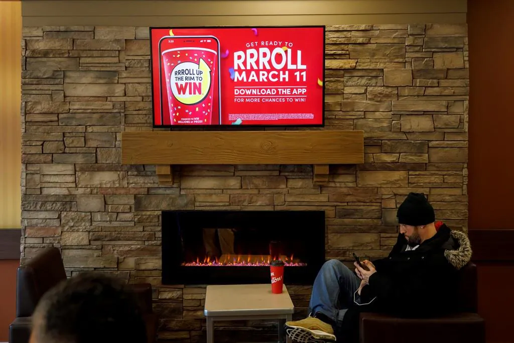 Signage for Tim Hortons' Roll Up the Rim contest is seen inside a Tim Hortons restaurant in Toronto, on March 6, 2020. (Cole Burston/The Canadian Press)