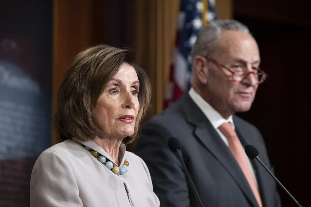 House Speaker Nancy Pelosi (D-Calif.) joined by Senate Minority Leader Chuck Schumer (D-N.Y.) speaks during a news conference on Capitol Hill in Washington on Feb. 11, 2020. (Alex Brandon/AP Photo)