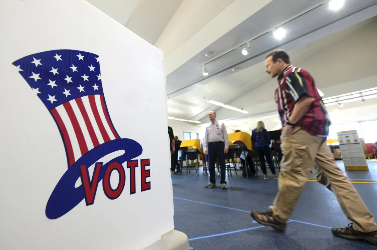 Voters cast their ballot at a voting center in El Segundo, Calif., on March 3, 2020. (AP Photo/Ringo H.W. Chiu)