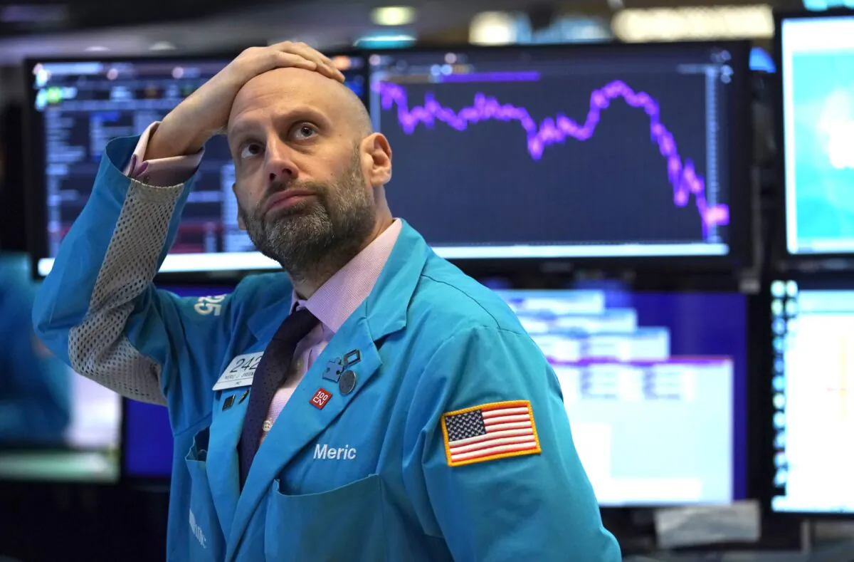 An employee reacts to market data on display at the New York Stock Exchange on March 9, 2020 in New York. (Timothy Clary/AFP via Getty Images)