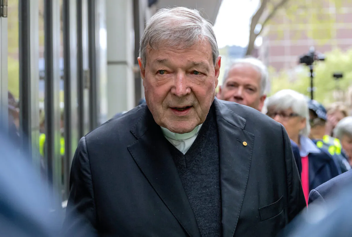 Vatican Treasurer Cardinal George Pell is surrounded by Australian police as he leaves the Melbourne Magistrates Court in Australia on Oct. 6, 2017. (Mark Dadswell/Reuters File) 