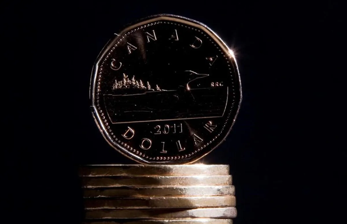 Canadian dollars are pictured in Vancouver on Sept. 22, 2011. (Jonathan Hayward/The Canadian Press)