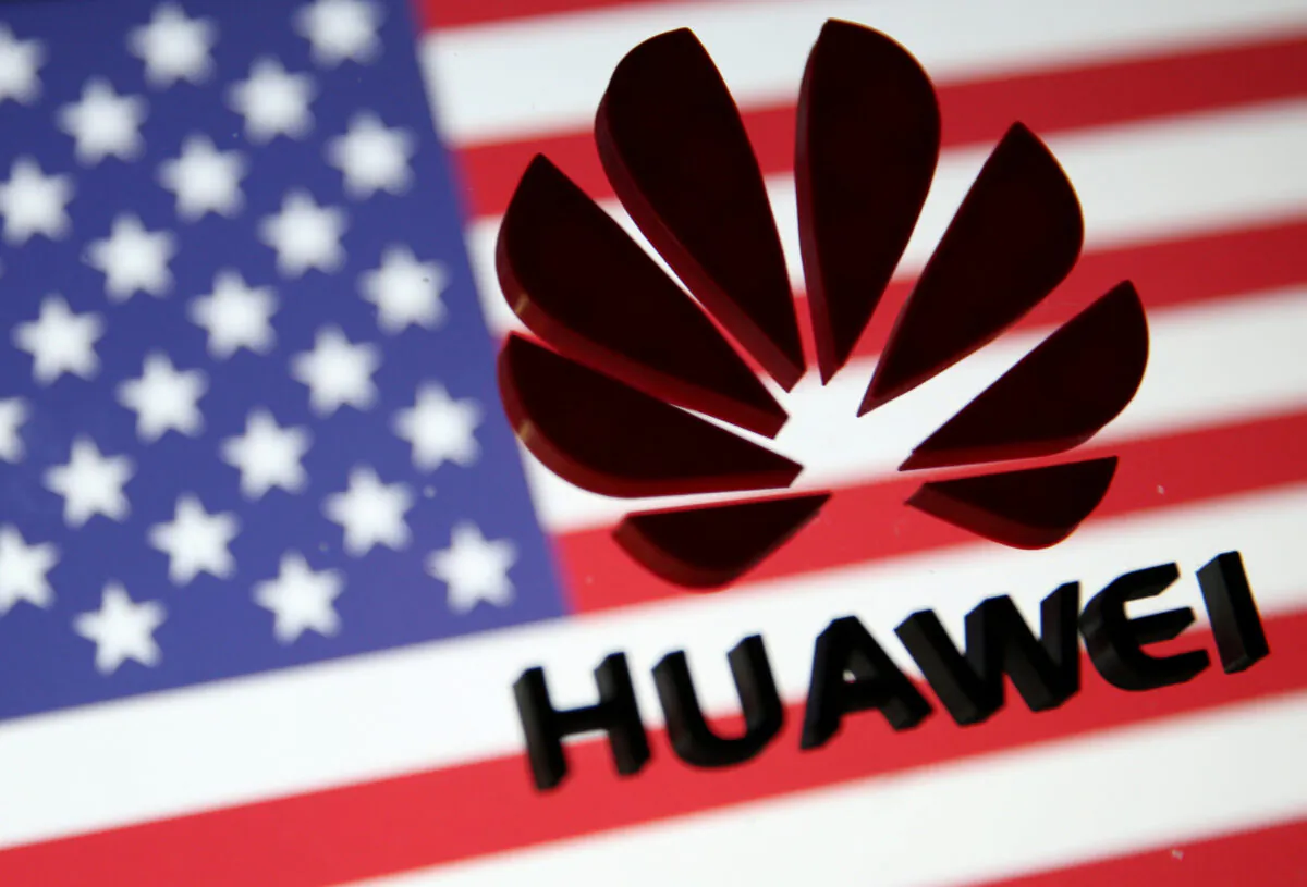 A 3D-printed Huawei logo is placed on glass above a displayed U.S. flag in this illustration taken on Jan. 29, 2019. (Dado Ruvic/Illustration/Reuters)