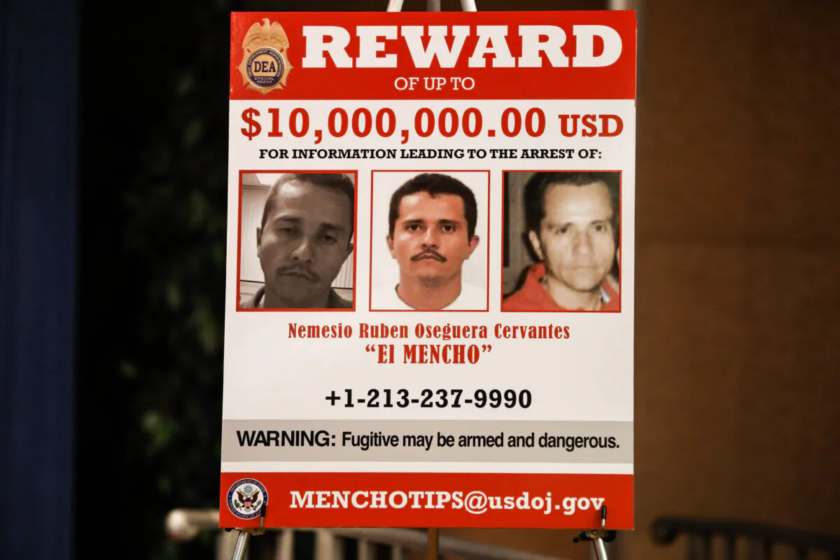 A poster at the Justice Department in Washington on March 11, 2020. (Charlotte Cuthbertson/The Epoch Times)