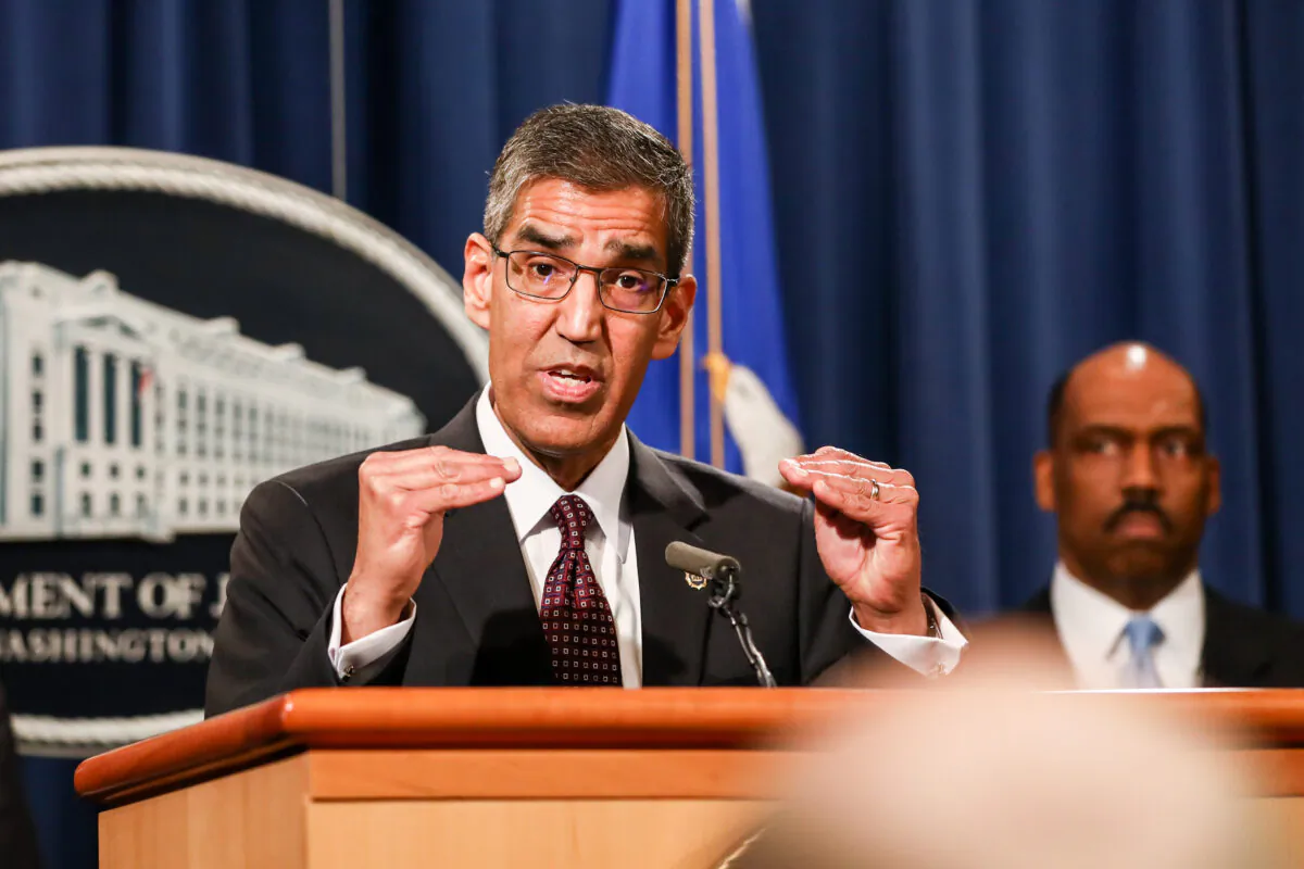 Acting DEA Administrator Uttam Dhillon, flanked by DEA and DOJ officials, speaks to media about an operation against a Mexican cartel at the Justice Department in Washington on March 11, 2020. (Charlotte Cuthbertson/The Epoch Times)