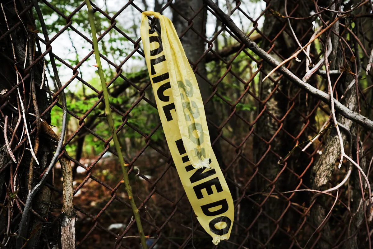 Crime scene tape hangs on a fence, in this file photo. (Spencer Platt/Getty Images)