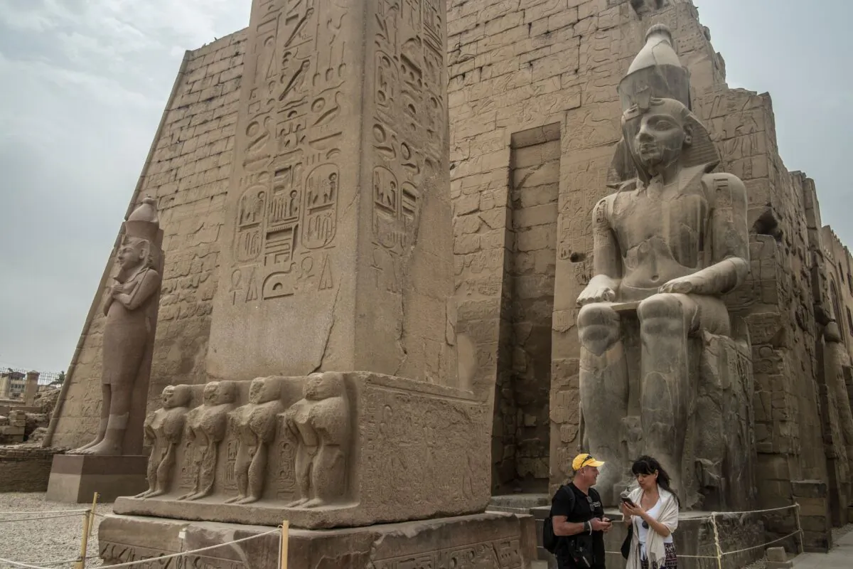 Tourists visit the Luxor Temple in Egypt's southern city of Luxor on March 11, 2020. (Khaled Desouki/AFP via Getty Images)