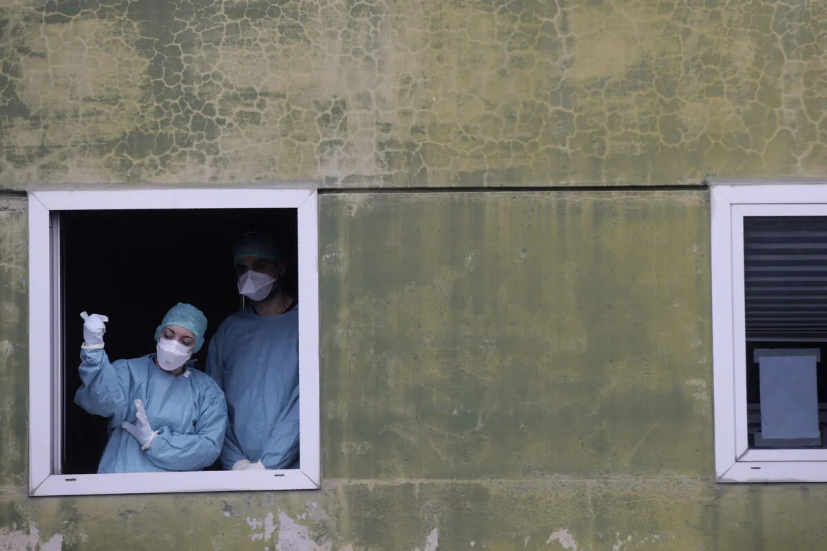 Medical staff at work at one of the emergency structures that were set up to ease procedures at the Brescia hospital, northern Italy, on March 12, 2020. (Luca Bruno/AP Photo)