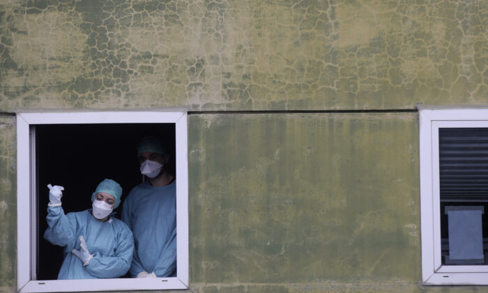 Medical staff at work at one of the emergency structures that were set up to ease procedures at the Brescia hospital, northern Italy, on March 12, 2020. (Luca Bruno/AP Photo)