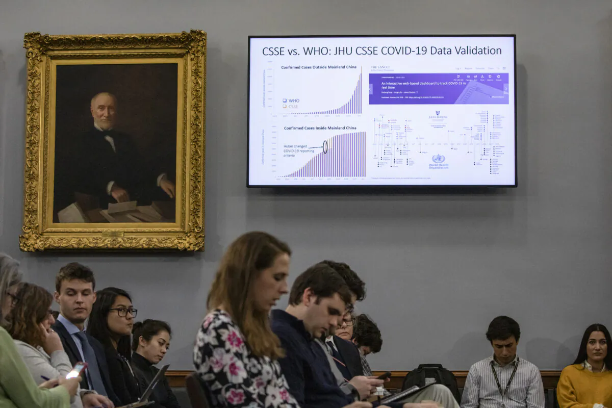 Statistics are shown on a screen during a briefing on the developments of the novel coronavirus, also known as COVID-19, from medical and research staff from Johns Hopkins University on Capitol Hill, Washington, D.C., on March 6, 2020. Johns Hopkins has been on the forefront of researching the coronavirus and developed the outbreak map dashboard that is being used by officials worldwide to track the virus. (Samuel Corum/Getty Images)