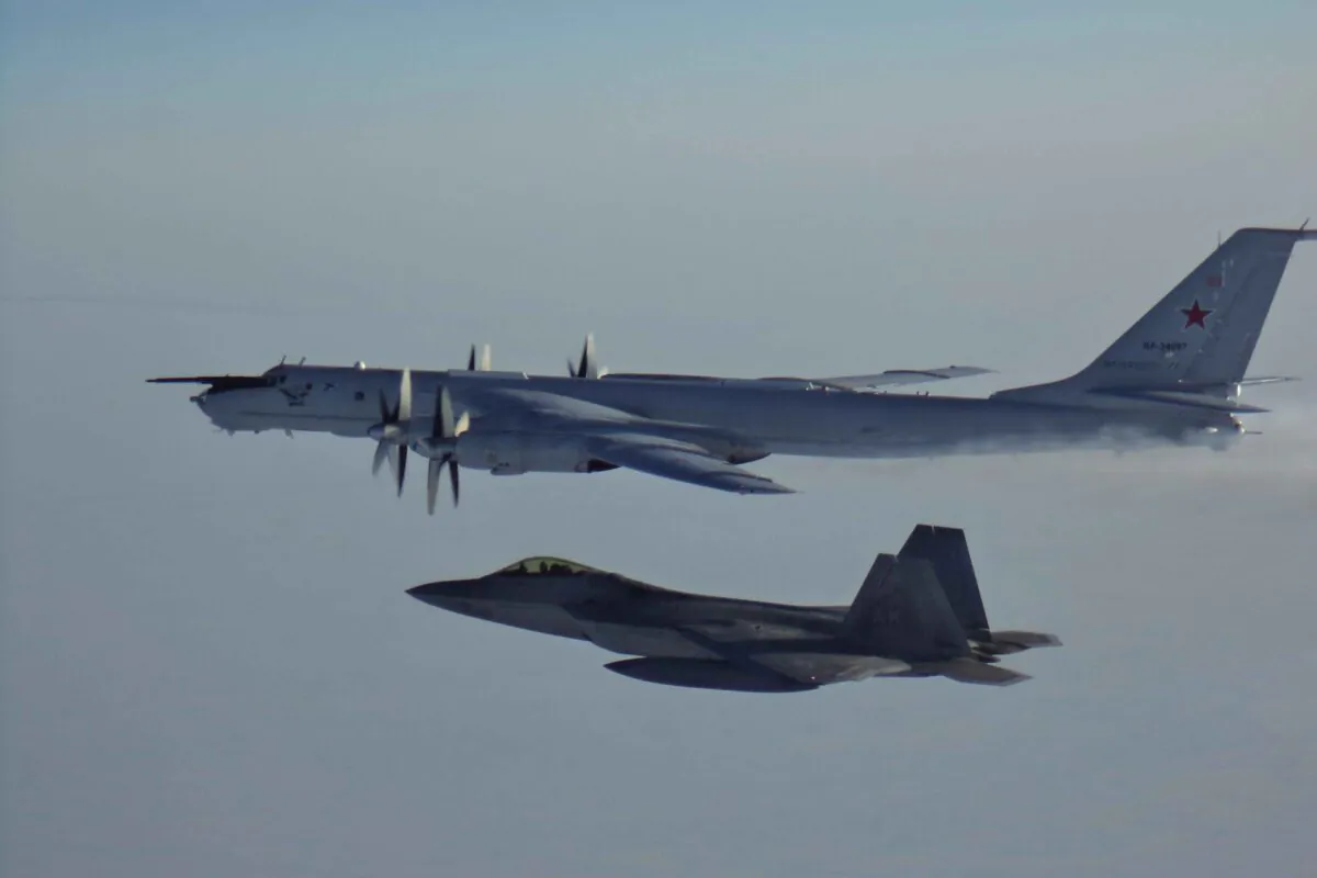 A Russian Tu-142 maritime reconnaissance aircraft escorted by an F-22 after entering the Alaskan Air Defense Identification Zone on March 9, 2020. (NORAD/DoD)