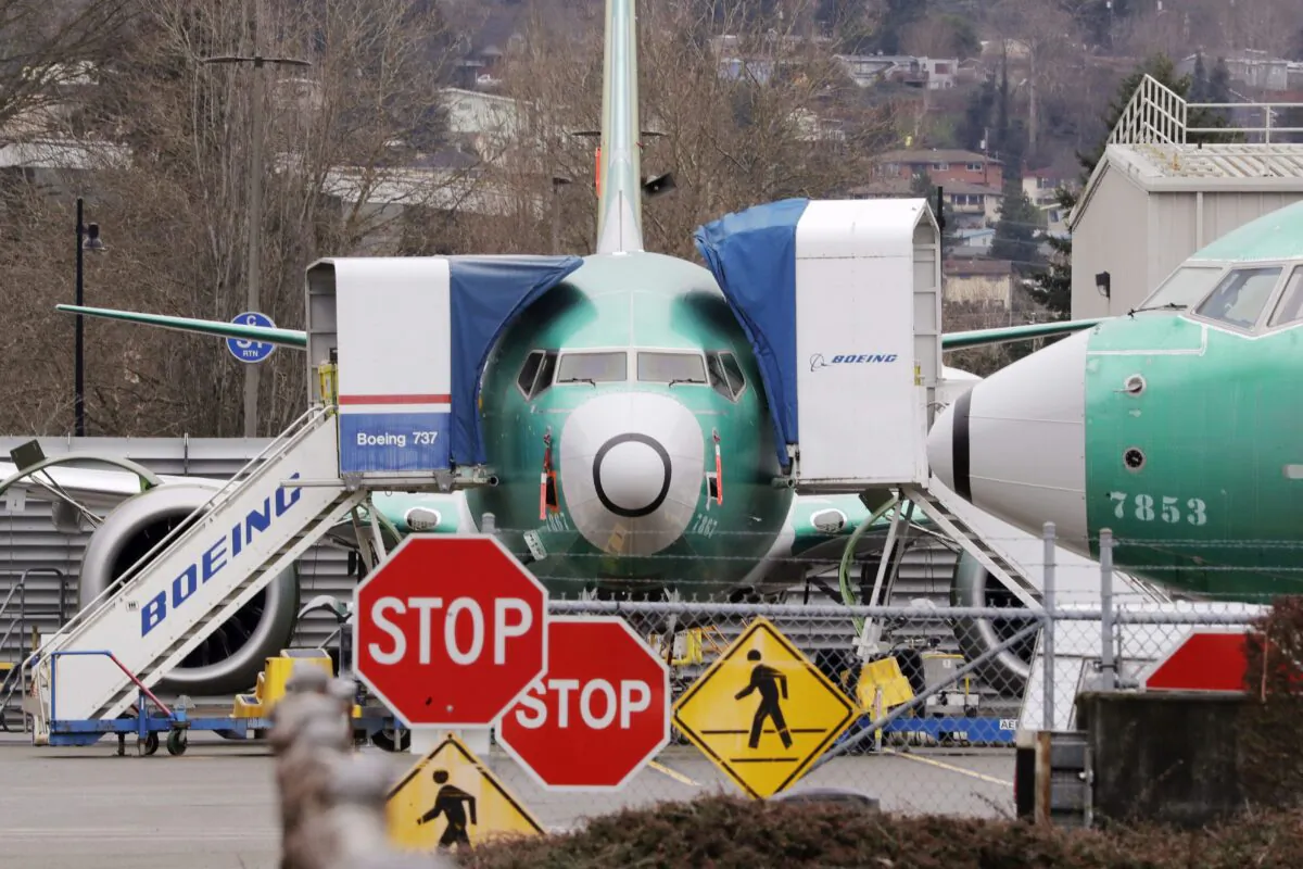 Boeing 737 Max jets sit parked in Renton, Wash., on Dec. 16, 2019. Internal government documents about the Boeing 737 Max are raising new questions about Canada's aircraft approval process. (The Canadian Press/AP, Elaine Thompson)