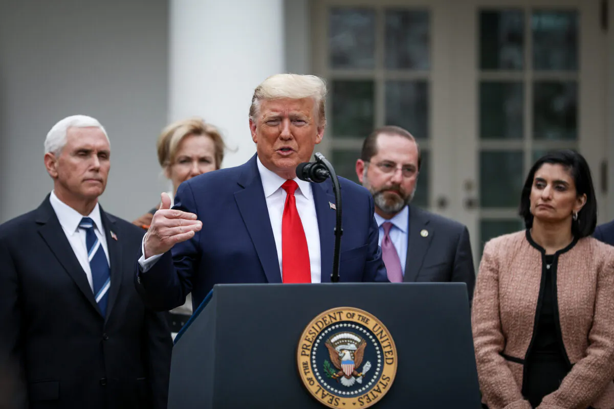 President Donald Trump, flanked by officials and business leaders, announces a national emergency with regard to the coronavirus in the White House Rose Garden in Washington on March 13, 2020. (Charlotte Cuthbertson/The Epoch Times)