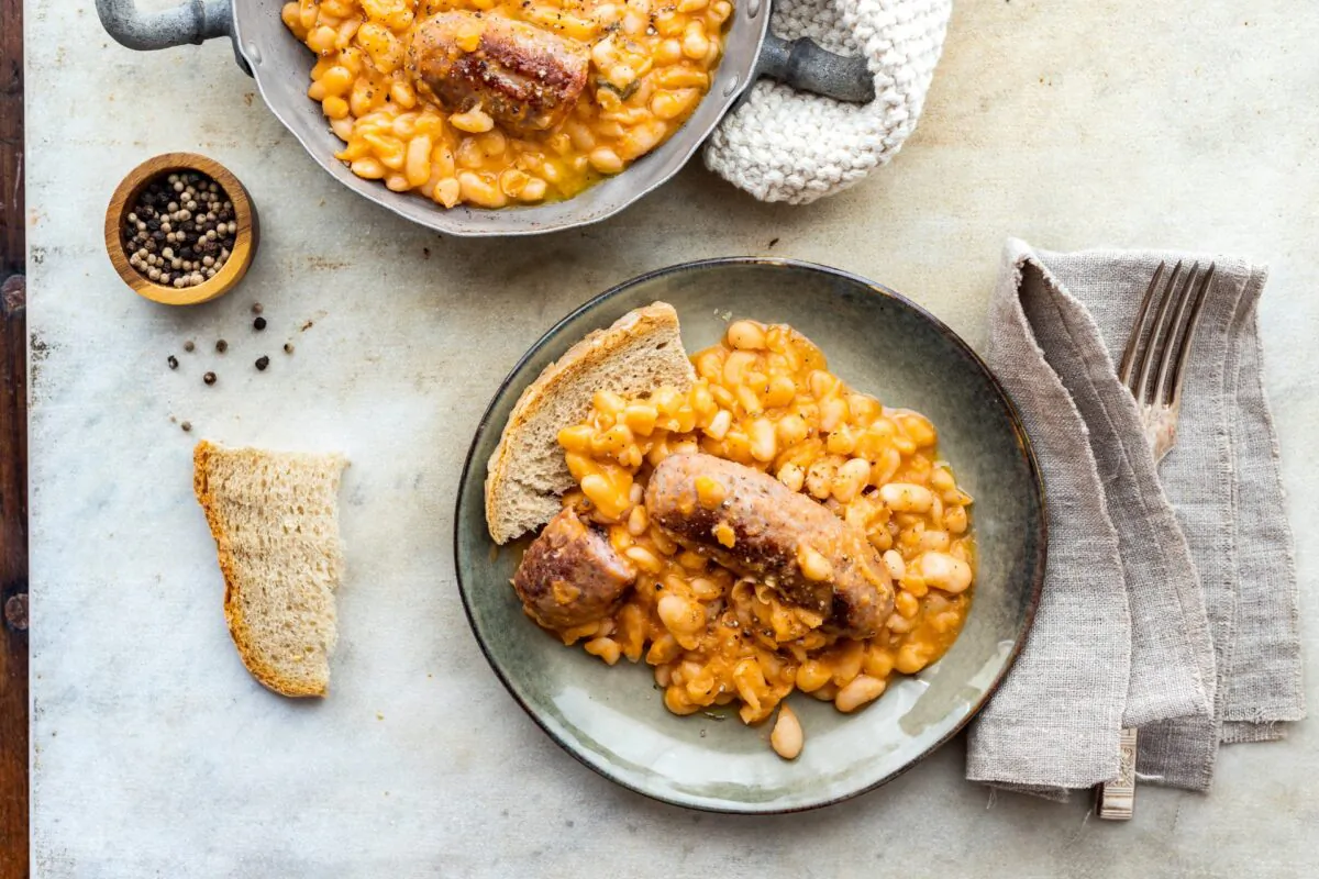 Beans feature in many traditional recipes of Tuscany's cucina povera. Simmer them slowly with tomato paste to make this fagioli all’uccelletto, bulked up with fresh sausage. (Giulia Scarpaleggia)